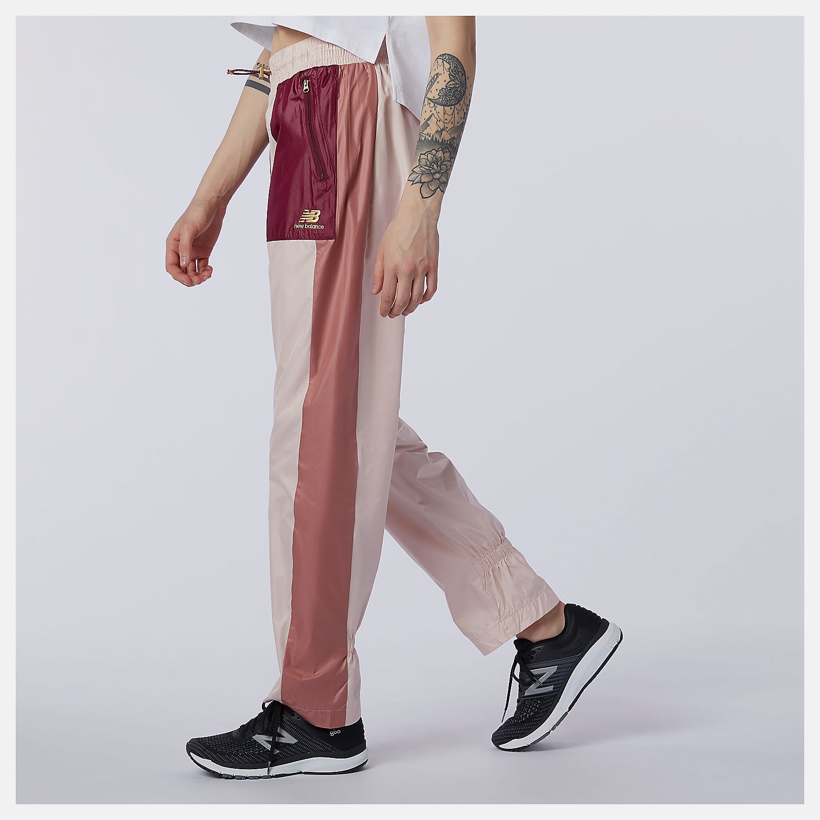 Oyster Pink NB Athletics Higher Learning Wind Pant / New Balance Women